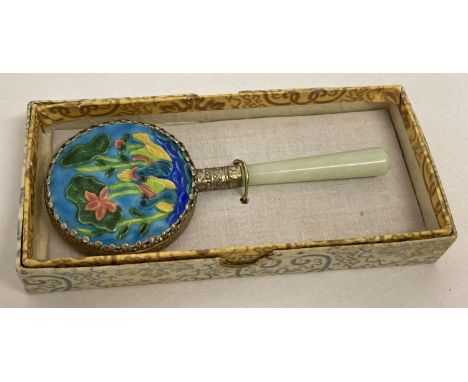 A vintage Chinese jade handled mirror with enamelled back panel depicting water birds and flowers.  In original box.  Approx.