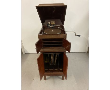 A vintage mahogany cased "His Master's Voice" gramophone with a small collection of 78 records.   Complete with wind up handl