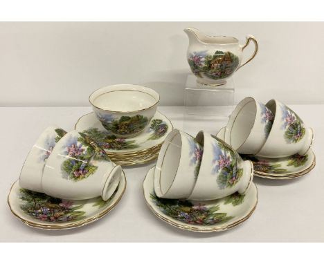 A 6 setting Royal Vale tea set with cottage garden design.  Comprising: milk jug, sugar bowl, 6 cups &amp; saucers and 6 tea 