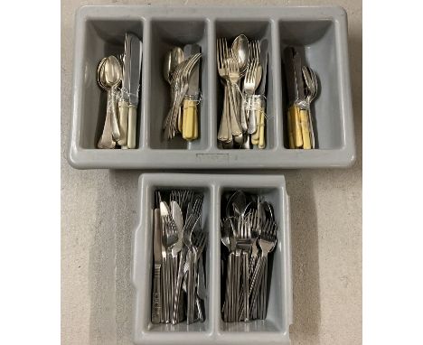 2 trays of modern and vintage cutlery in varying designs.  To include knives, forks and dessert spoons. 