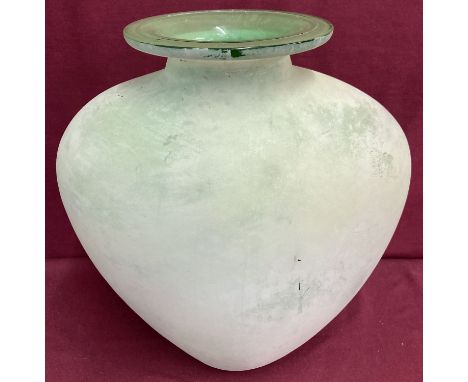 A large green art glass vase of bulbous form.  