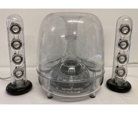A Harmon Kardon sound sticks wired speaker system.  Working order. Small plastic inner section on 1 speaker needs attention. 