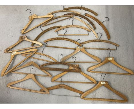 22 vintage wooden advertising coat hangers for tailors, hotels and cleaners.  To include William Turner Stowmarket, Lewis Bru