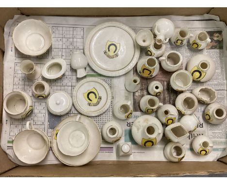 A box of vintage ceramic Oakham crested ware ceramic items, mostly Goss.  To include: teapot stand, cups and saucers and top 