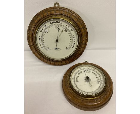 A vintage carved wooden cased circular wall hanging barometer by R.Bailey, Birmingham.  Together with another circular vintag