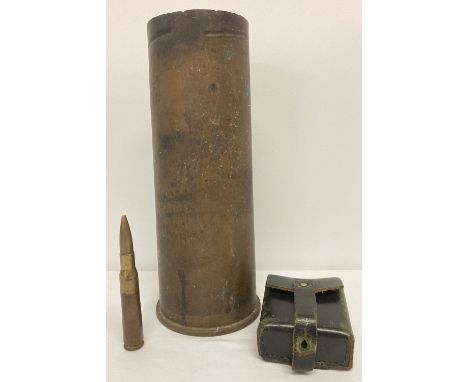 A vintage 105mm field gun shell case dated 1968.  Together with a metal lined leather ammo pouch and one other. 