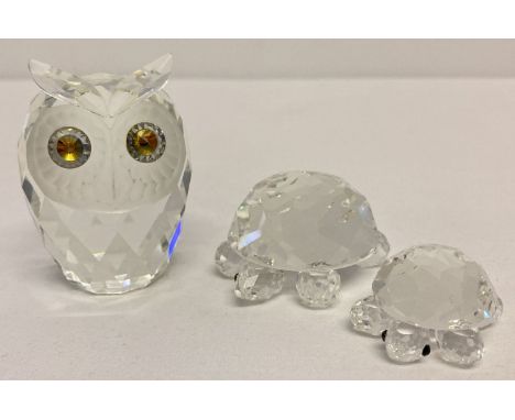 A vintage Swarovski Crystal owl figurine together with 2 tortoise figures.  Owl has coloured glass eyes, frosted facial detai