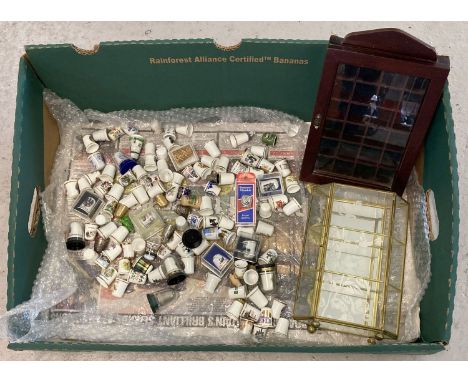 A collection of 100+ ceramic, metal wood and wicker collectors thimbles some in original packaging.  Together with 2 small di