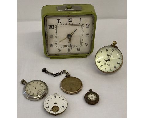 A modern design ball clock together with a vintage green painted alarm clock.  Lot also includes pocket watches and parts.  S