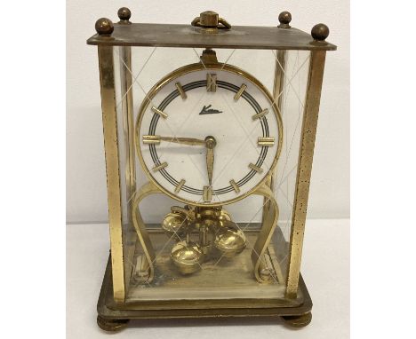 A vintage German brass cased Kern torsion pendulum Anniversary clock.   Approx. 18.5cm tall.