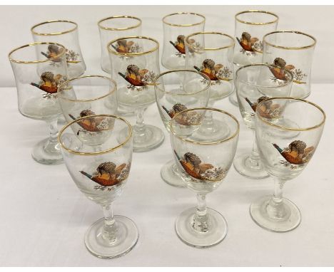 A collection of 14 vintage sherry and liquor glasses with pheasant and gold rim decoration.  