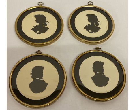 A set of 4 vintage brass framed silhouette portrait prints.  Each with "FR" initials.  Approx. 10cm diameter.