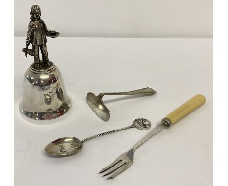 A silver spoon with twisted stem and openwork "Baby" finial.  Together with a silver plate pickle fork and baby pusher and a 