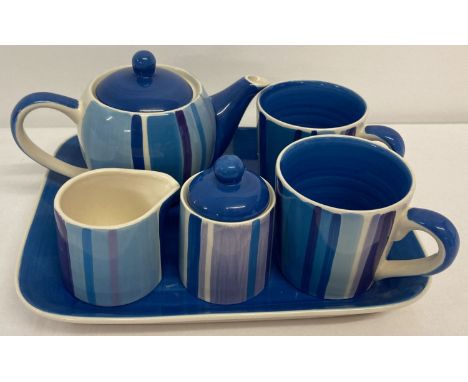 A ceramic tea for two set by Whittard in a blue and lilac stripe pattern.  Comprising: teapot, sugar bowl, milk jug, 2 mugs a