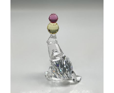 Part of the Cheerful Times group figure is made from clear crystal with jet crystal eyes balancing balls of rose and jonquil 