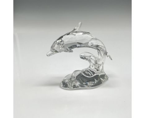 Clear faceted crystal figural riding a smooth wave, watching with aqua crystal eyes. Swarovski backstamp. 7664 000 001. This 