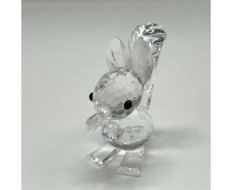 Crystal figural holding a nut is part of the Rare Encounters group. This version with longer ears, represents the red squirre