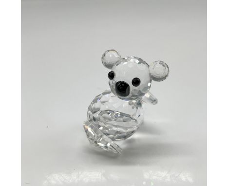 Clear faceted crystal head and body with jet crystal button eyes and nose. Swarovski backstamp. 7673 030 000. This item has i