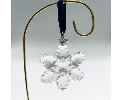 Sparkling star or snowflake shaped tree ornament in clear faceted crystal. Swarovski mark. This item has its original box: 5.