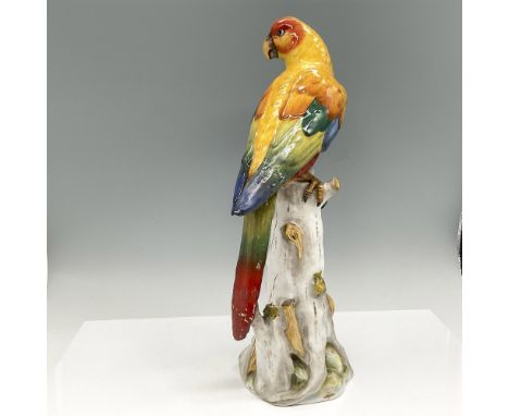Colorful representation of this beautiful bird perched on a tree trunk. Feathers are yellow, red, blue and green. Long tail f