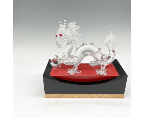 Part of the Fabulous Creatures trilogy, figural is created from clear crystal looking out with his red crystal eyes with foot