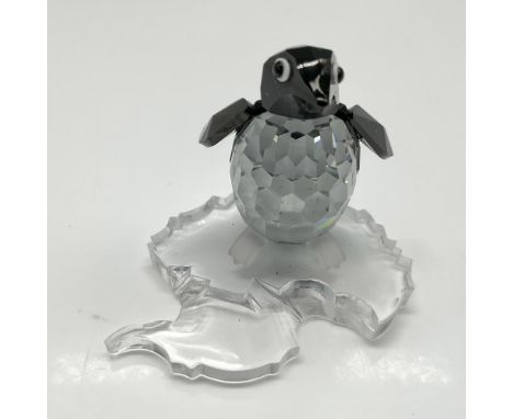 Part of the Kingdom of Ice and Snow theme group. Figural created with faceted clear and jet crystal with satin crystal feet, 