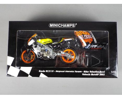 Minichamps - a 1:12 scale diecast model Honda RC211V, Repsol Honda Team, as ridden by Valentino Rossi, MotoGP 2003, appears m