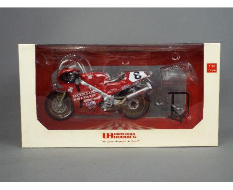 Universal Hobbies - a 1:12 scale diecast model Honda RC 30 as ridden by Carl Fogarty, appears mint in box # UH4822 (small tea