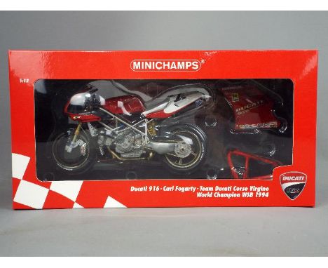 Minichamps - a 1:12 scale diecast model Ducati 916, Carl Fogarty, Team Ducati Corse Virgino, World Champion WSB 1994, appears