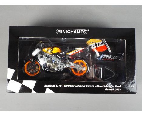 Minichamps - a 1:12 scale diecast model Honda RC211V, Repsol Honda Team, as ridden by Valentino Rossi, MotoGP 2003, appears m