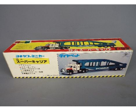 Yonezawa Diapet - A boxed 1:50 scale diecast T92 Mac Auto Transporter by the Japanese manufacturer Diapet. The model appears 