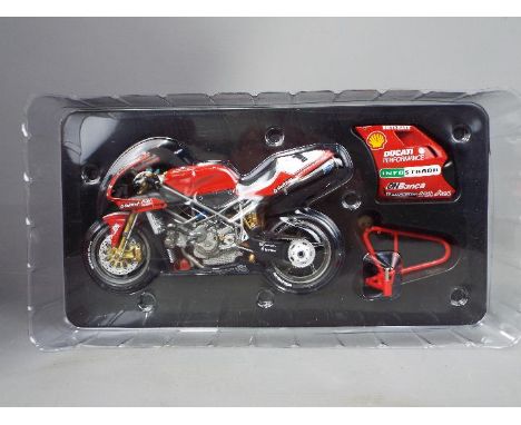 Minichamps - a 1:12 scale diecast model Ducati 996 Superbike, Carl Fogarty, World Champion 1999, appears mint in box # 122 99