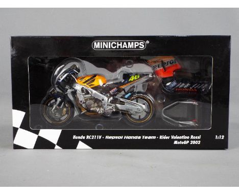 Minichamps - a 1:12 scale diecast model Honda RC211V, Repsol Honda Team, as ridden by Valentino Rossi, MotoGP 2002, appears m