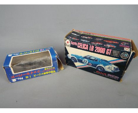 Sakura, Eidai Grip - Two interesting boxed Japanese diecast model cars. Lot consists of Sakura 1:43 scale #2 Pontiac Firebird