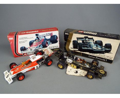 Corgi - Two boxed Corgi racing cars. Lot includes #191 1:18 scale Texaco-Marlboro McLaren M23 F1; and #190 JPS Lotus Formula 