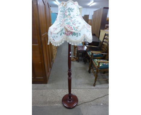 A mahogany standard lamp 
