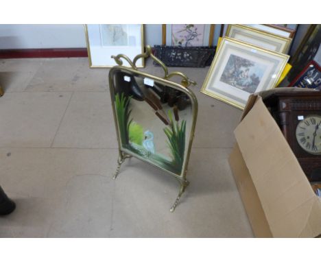 An Art Nouveau brass fire screen 