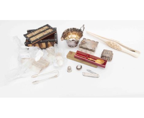 A mixed lot including a small silver jewel caskert, lidded trinket box, plated cream jug, antique ivory glove stretchers, a q