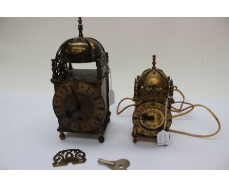 A brass mantle clock, Smiths, key Roman numerals with a similar un-named electric clock