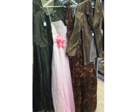 A late 1940s evening dress with a black tulle overlay over a sage underskirt in taffeta, sweetheart neckline corsage on waist