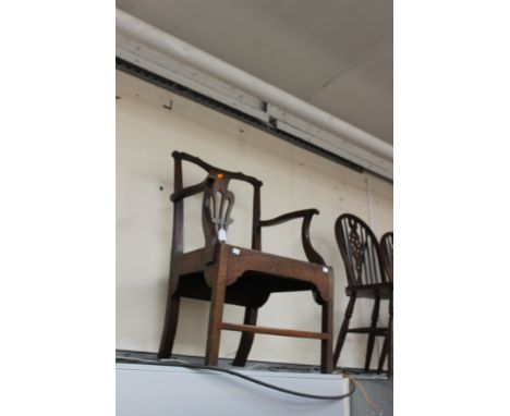 A George III joined oak open armchair, in the Chippendale manner, circa 1765, pierced back splat, standing on square legs