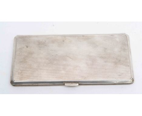 A George VI silver engine turned cigarette case, Birmingham 1942, having a gilt lined interior, 271.6 grams/8.73 ozt approx 