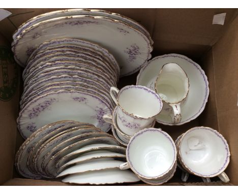 A late Victorian Foley china part tea set in lilac floral pattern comprising eleven cups, eleven saucers, twelve side plates 