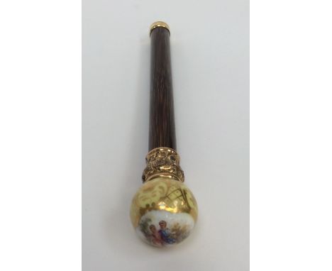 A French parasol handle with porcelain finial painted courtly couple within yellow and gilt border and gilt collar