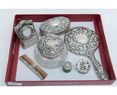 Silver embossed dressing table set, Birmingham, indistinct date mark, clock, etc 