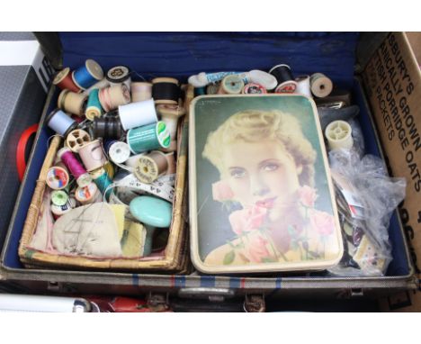 A 1940s suitcase, two mantlew clocks, sewing basket and contents including hatpins (3), Sylco cottons, scissors, darning mush