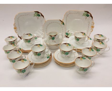 A Shelley, Art Deco, hand finished tea set, comprising: twelve cups; twelve saucers; twelve side plates; two sandwich plates 