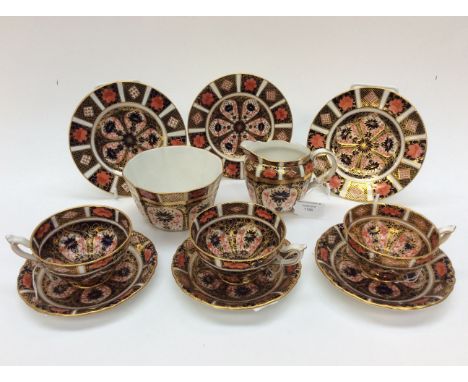 Royal Crown Derby Imari, 1128 pattern, three tea cups, saucers, side plates, mulk and slops bowl (11 items) 