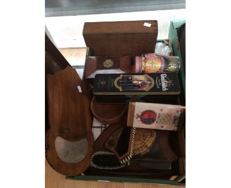 A box of assorted treen comprising a George III mahogany tea caddy and Edwardian brush set, letter rack, wooden shield, box v