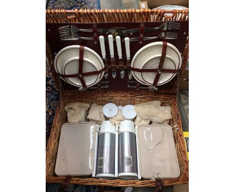 An Optica wicker cased picnic hamper, 1960s, with fitted interior